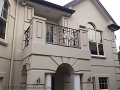 Juliet balcony with decorative wrought iron balustrade
