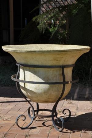 wrought iron base with large GRC bell pot